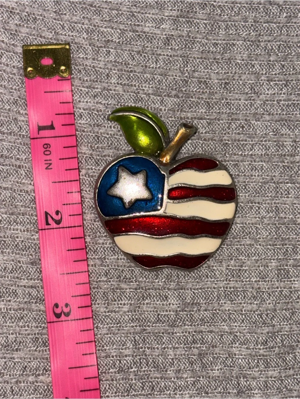 Vintage AJMC marked silver tone American flag apple brooch